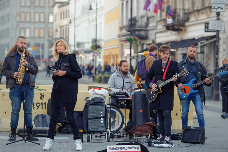 17 - Band performing on a street, identified as a street music performance - 2